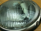 Complete headlight set ( as is ....new with 1 partially  cracked lens)